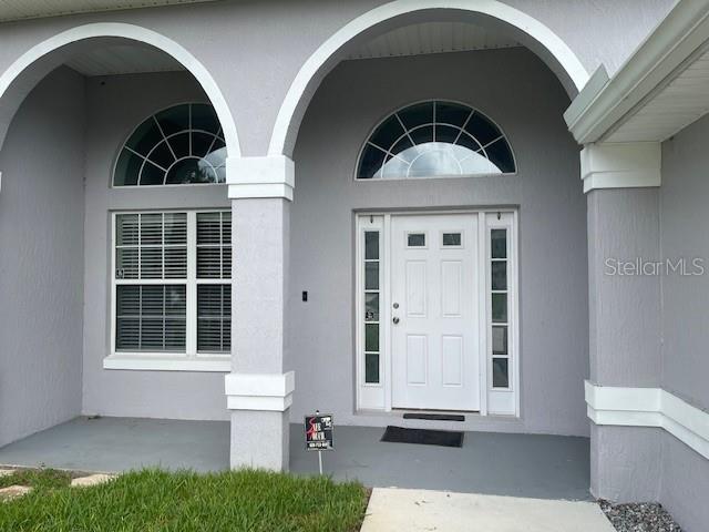 23 Ridley Lane, Unit B Palm Coast, FL 32164 - Photo 2 of 17 a front view of a house with a yard