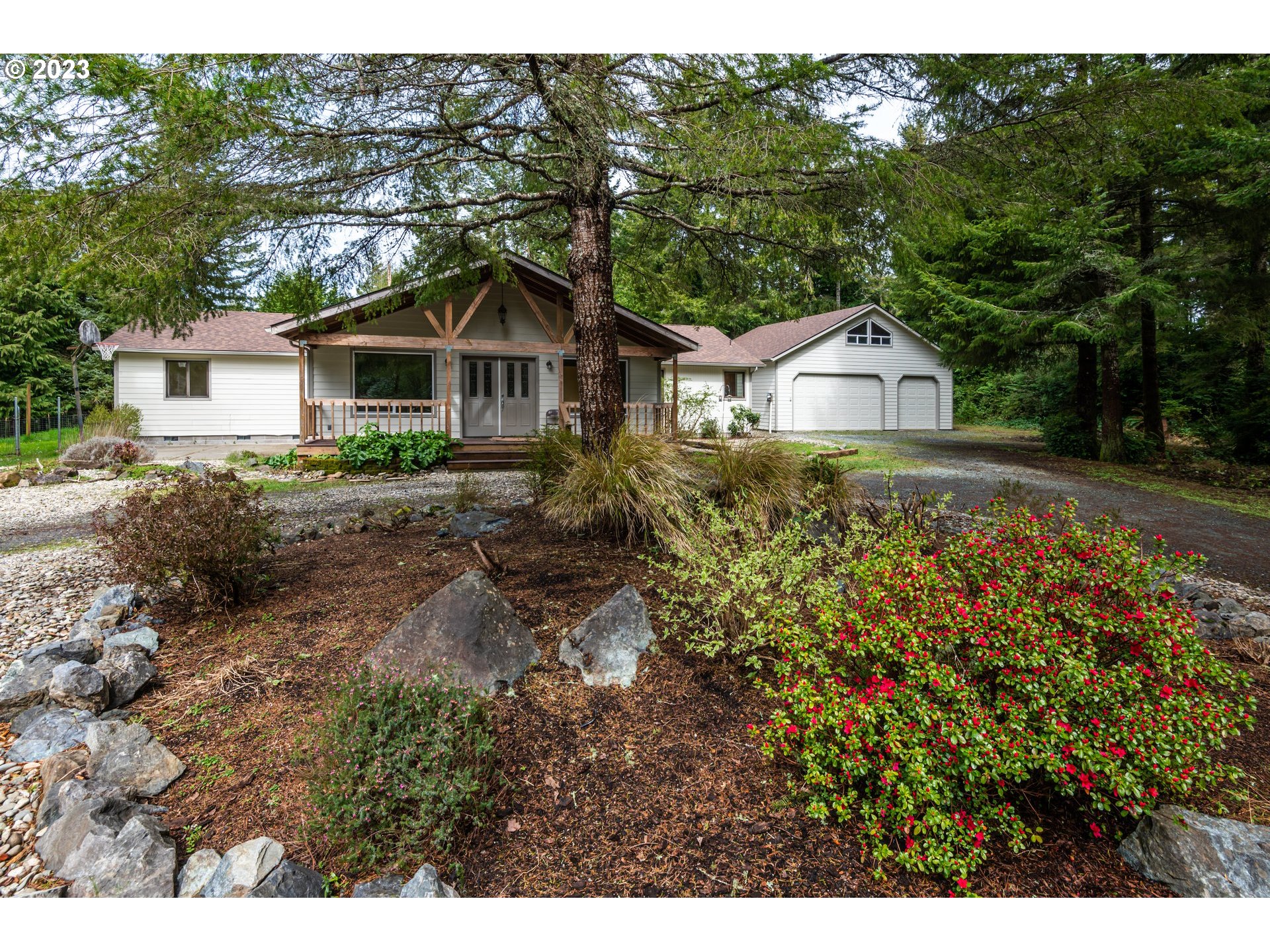87763 Two Mile Lane Bandon, OR 97411 - Photo 1 of 41 a small house with a tree in the background
