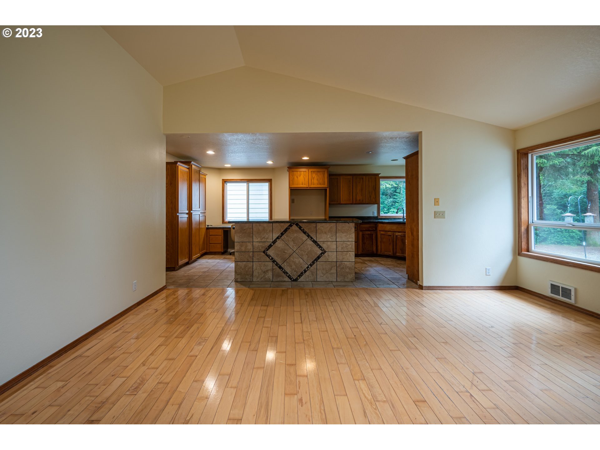 87763 Two Mile Lane Bandon, OR 97411 - Photo 11 of 41 a view of empty room with wooden floor and furniture
