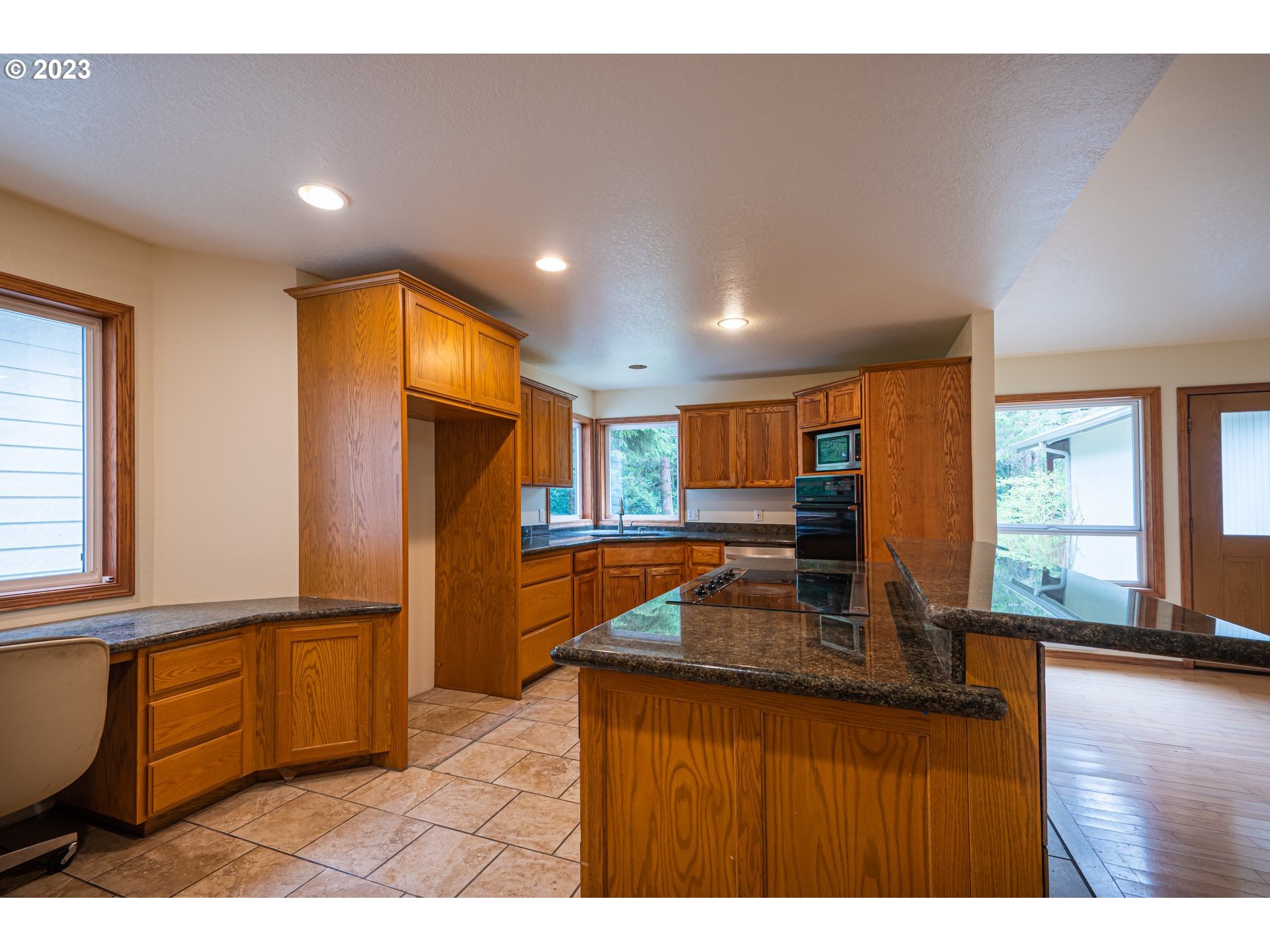 87763 Two Mile Lane Bandon, OR 97411 - Photo 15 of 41 a kitchen with stainless steel appliances granite countertop a refrigerator and a stove