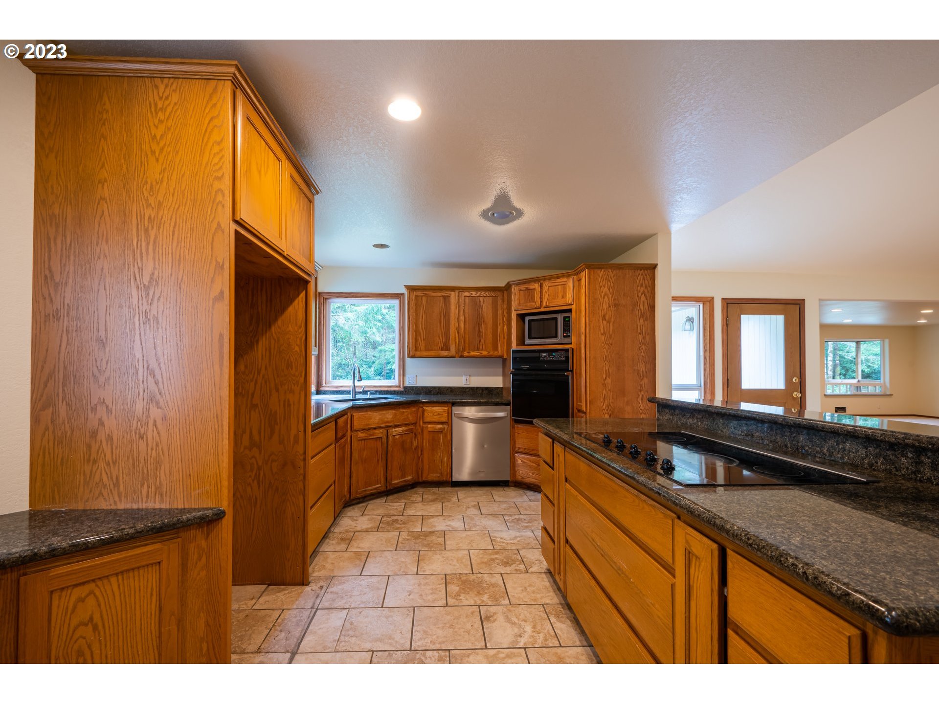 87763 Two Mile Lane Bandon, OR 97411 - Photo 16 of 41 a large kitchen with a large window