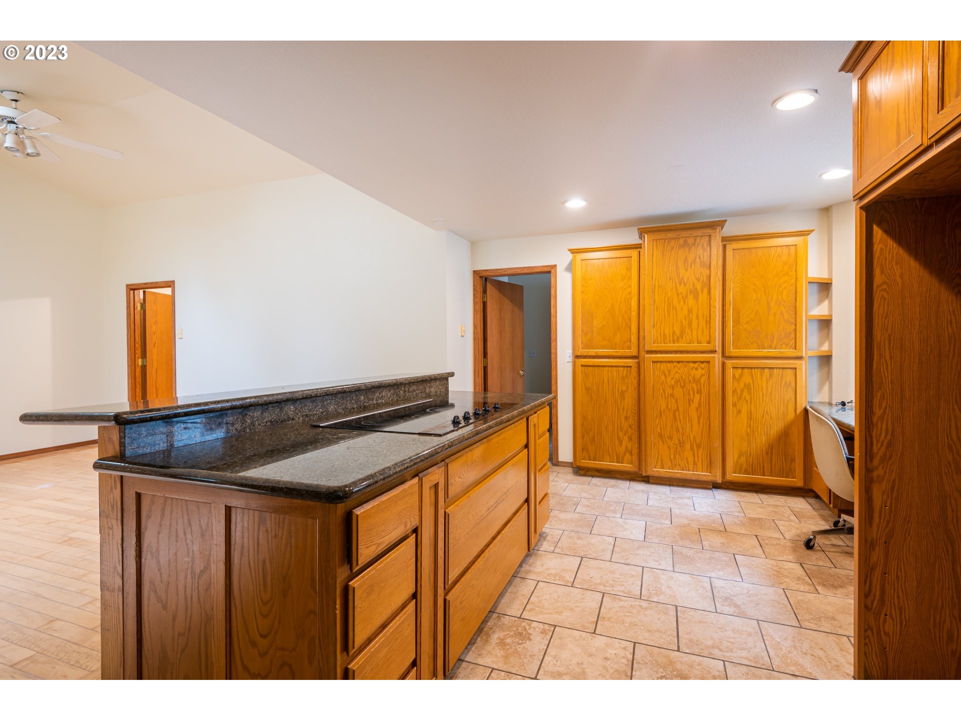 87763 Two Mile Lane Bandon, OR 97411 - Photo 19 of 41 a kitchen with stainless steel appliances granite countertop a sink and a refrigerator