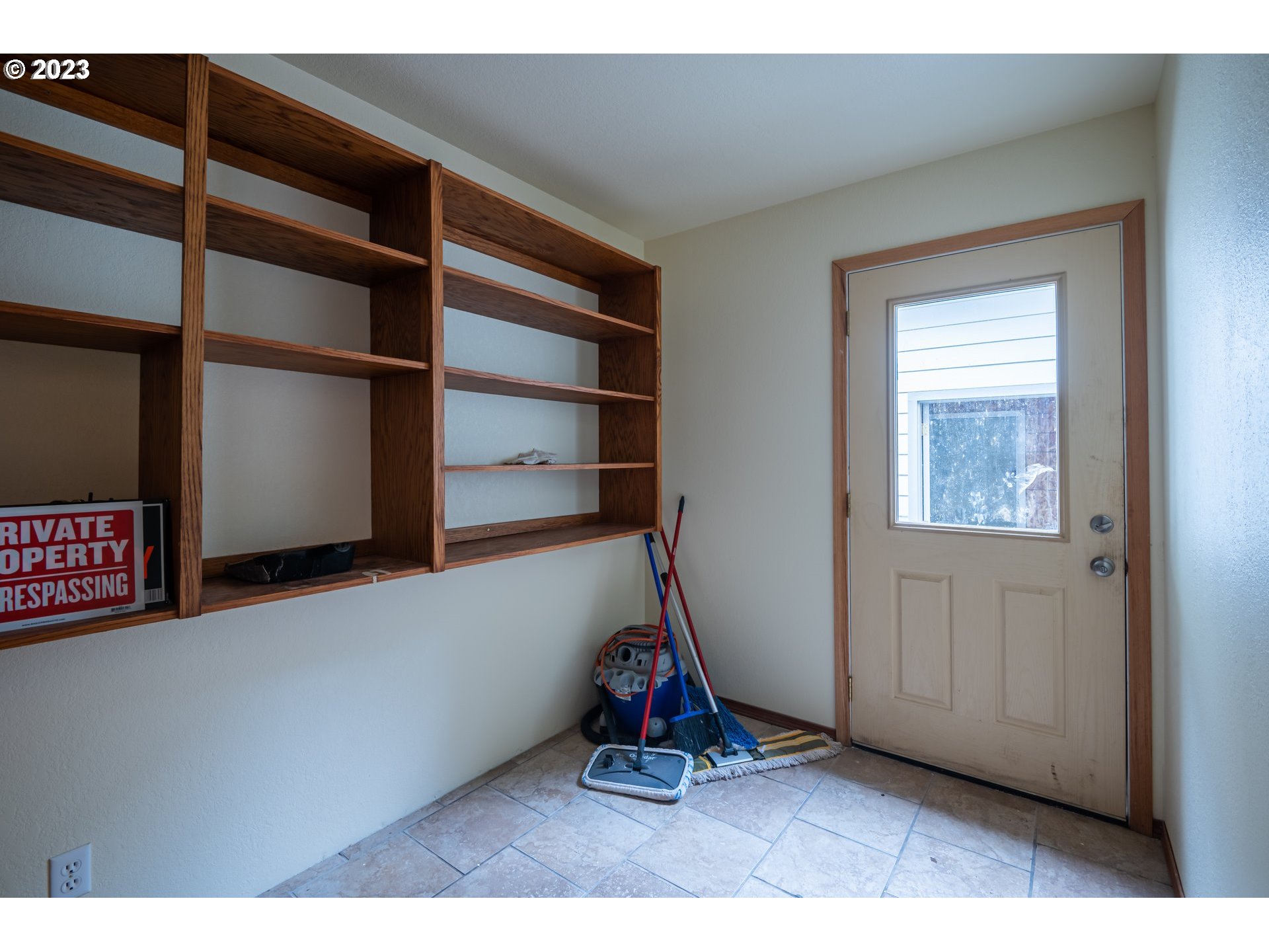 87763 Two Mile Lane Bandon, OR 97411 - Photo 21 of 41 a view of an empty room with wooden floor and windows