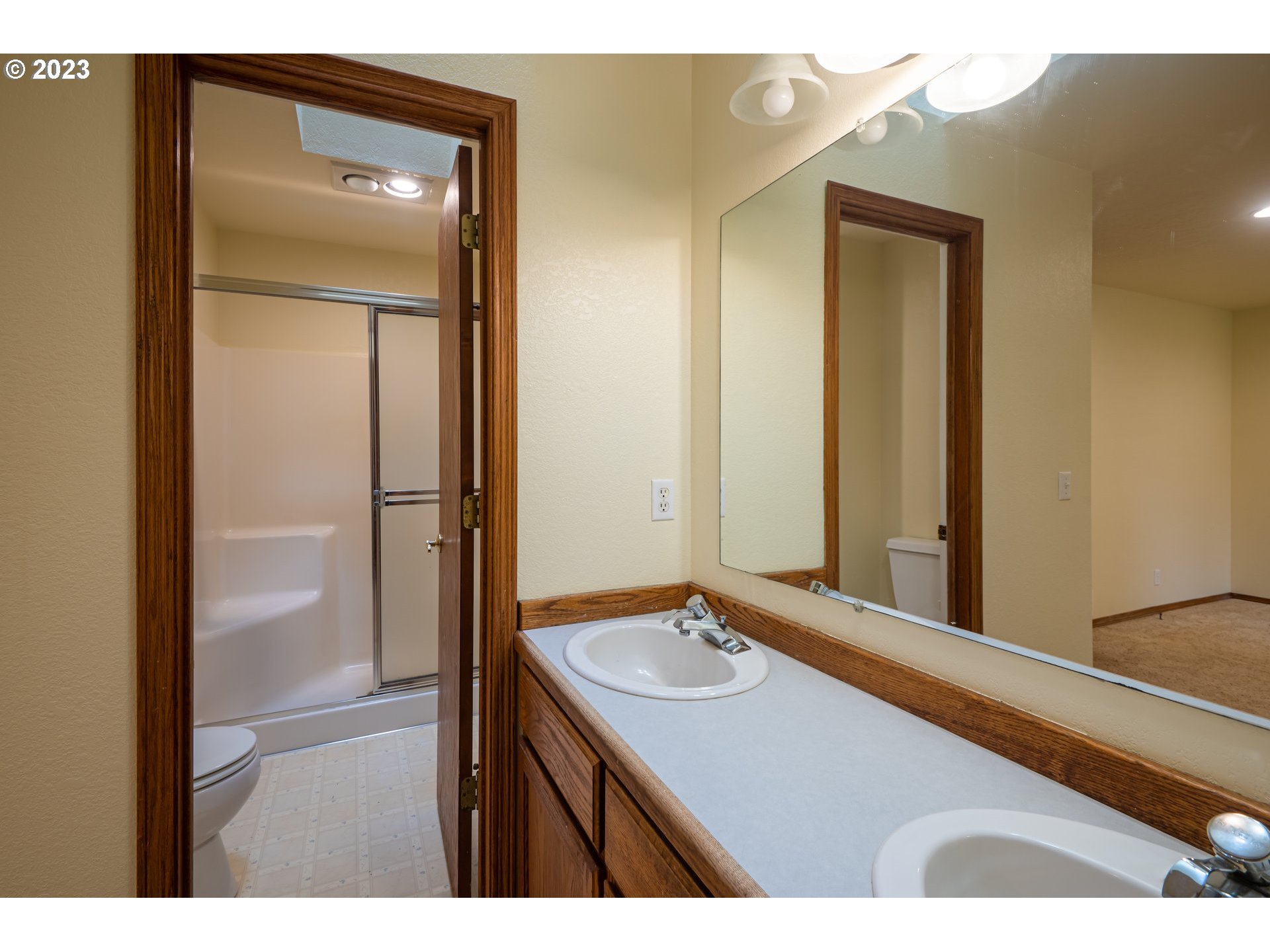 87763 Two Mile Lane Bandon, OR 97411 - Photo 29 of 41 a bathroom with a sink vanity and a mirror