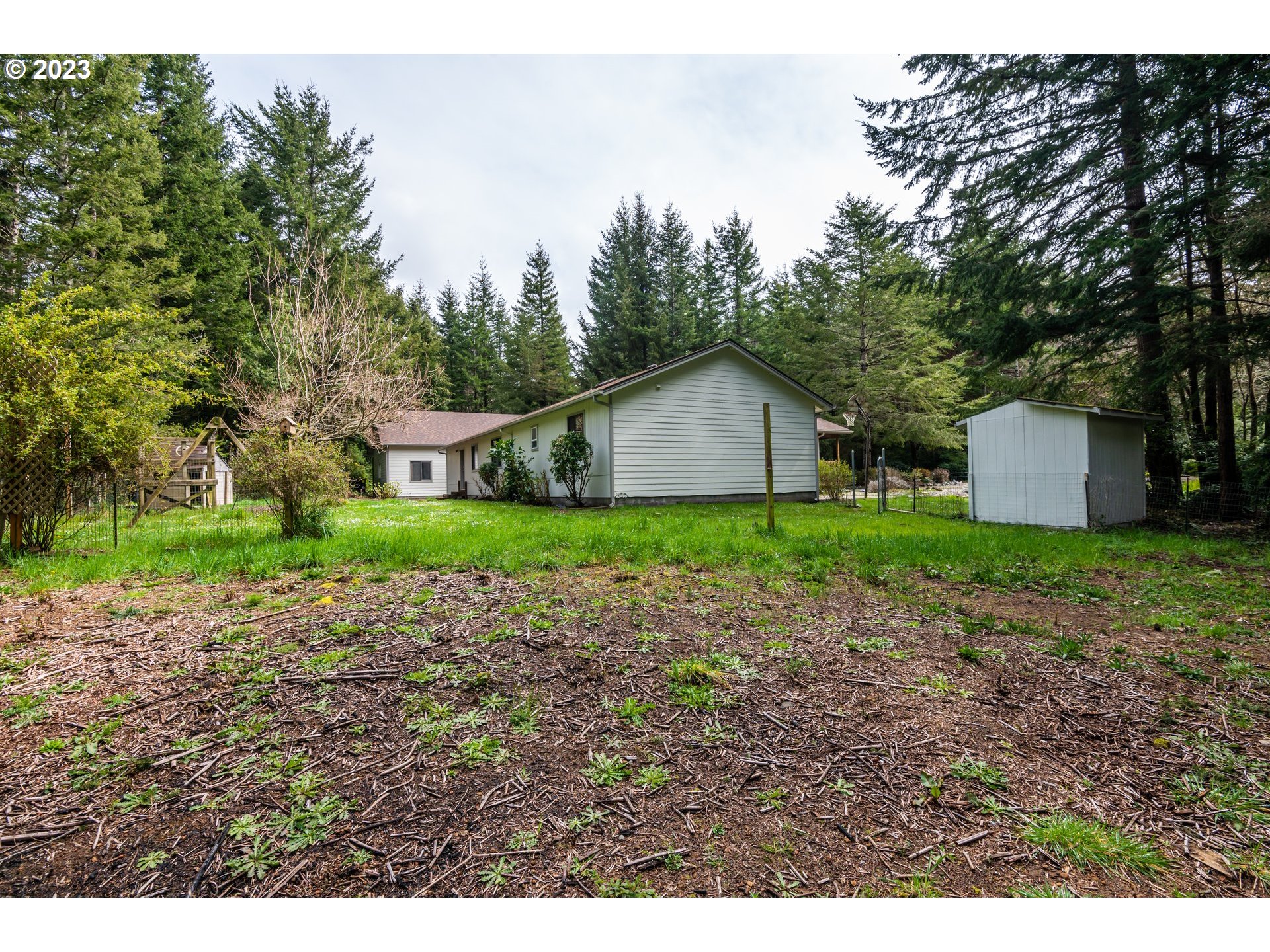 87763 Two Mile Lane Bandon, OR 97411 - Photo 36 of 41 a house view with a garden space