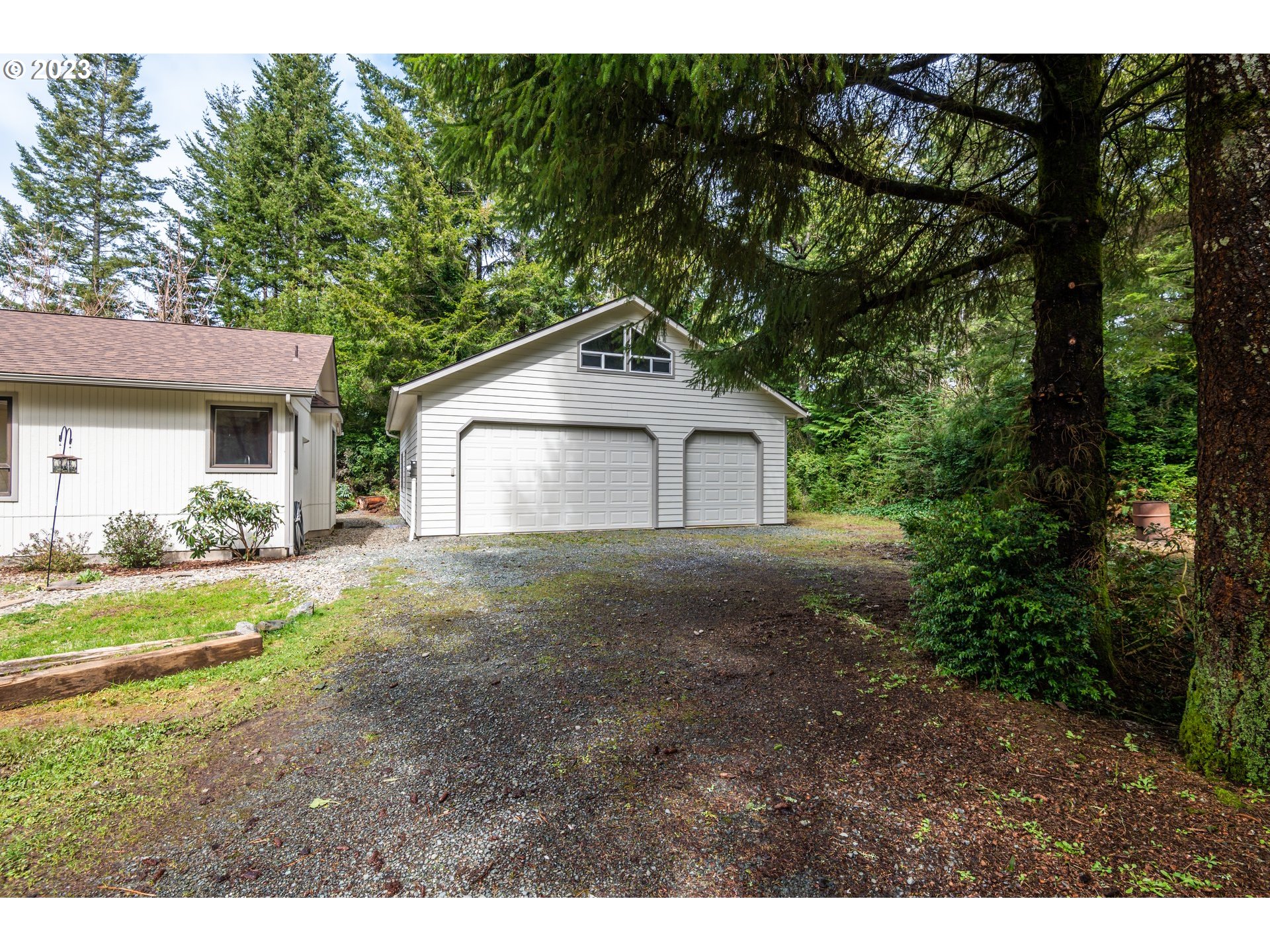 87763 Two Mile Lane Bandon, OR 97411 - Photo 6 of 41 a house view with a outdoor space