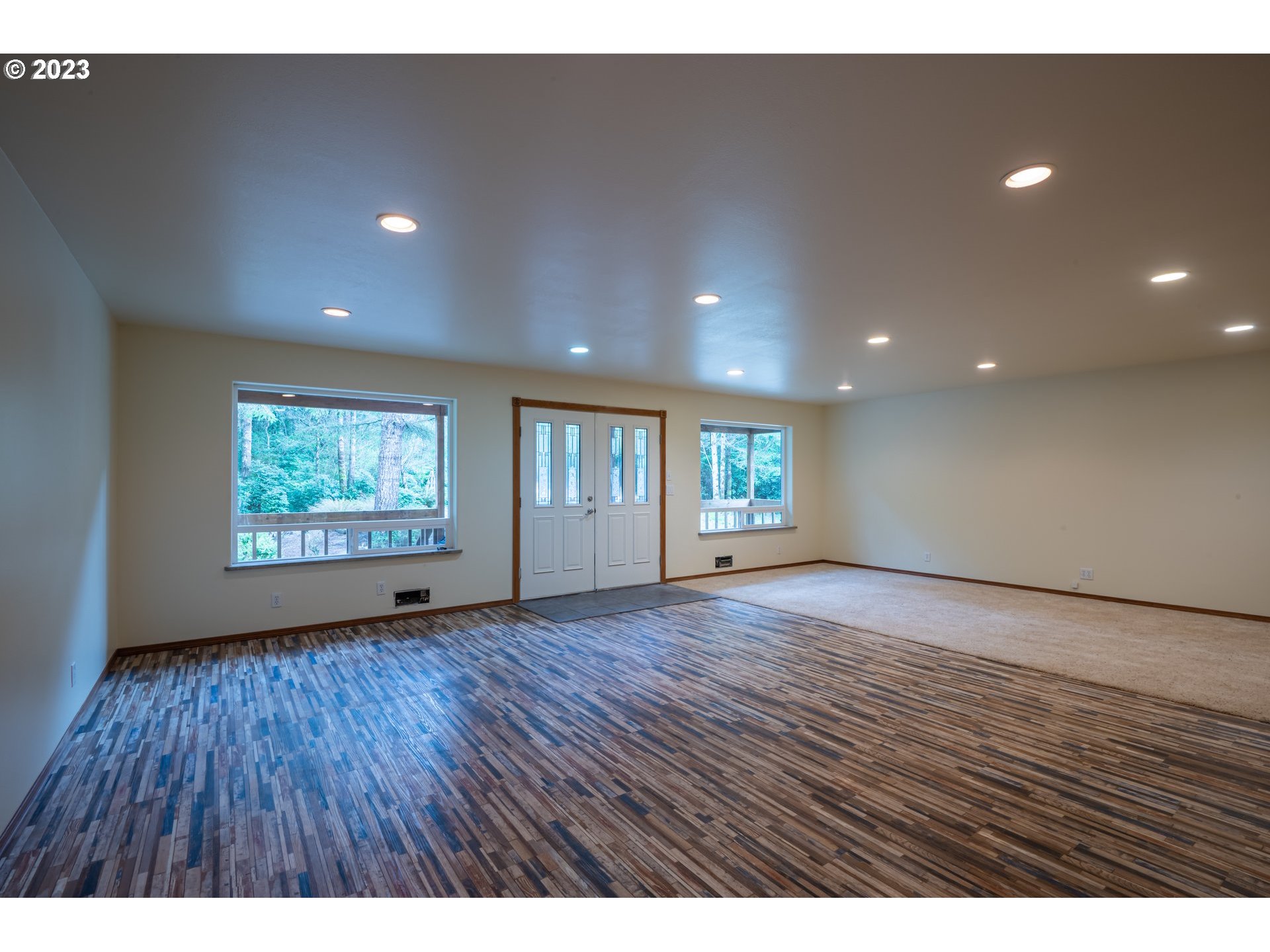 87763 Two Mile Lane Bandon, OR 97411 - Photo 7 of 41 a view of an empty room with wooden floor and window
