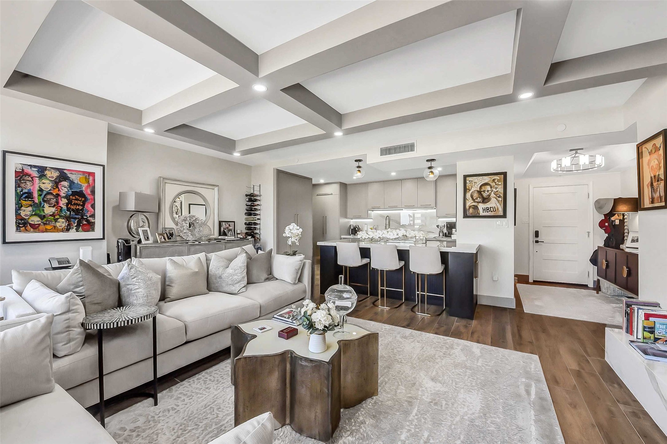 1111 Caroline Street, Unit 2903 Houston, TX 77010 - Photo 1 of 27 Step inside to a bright, open concept living space with a refined contemporary design, featuring coffered ceilings and integrated recessed lighting.