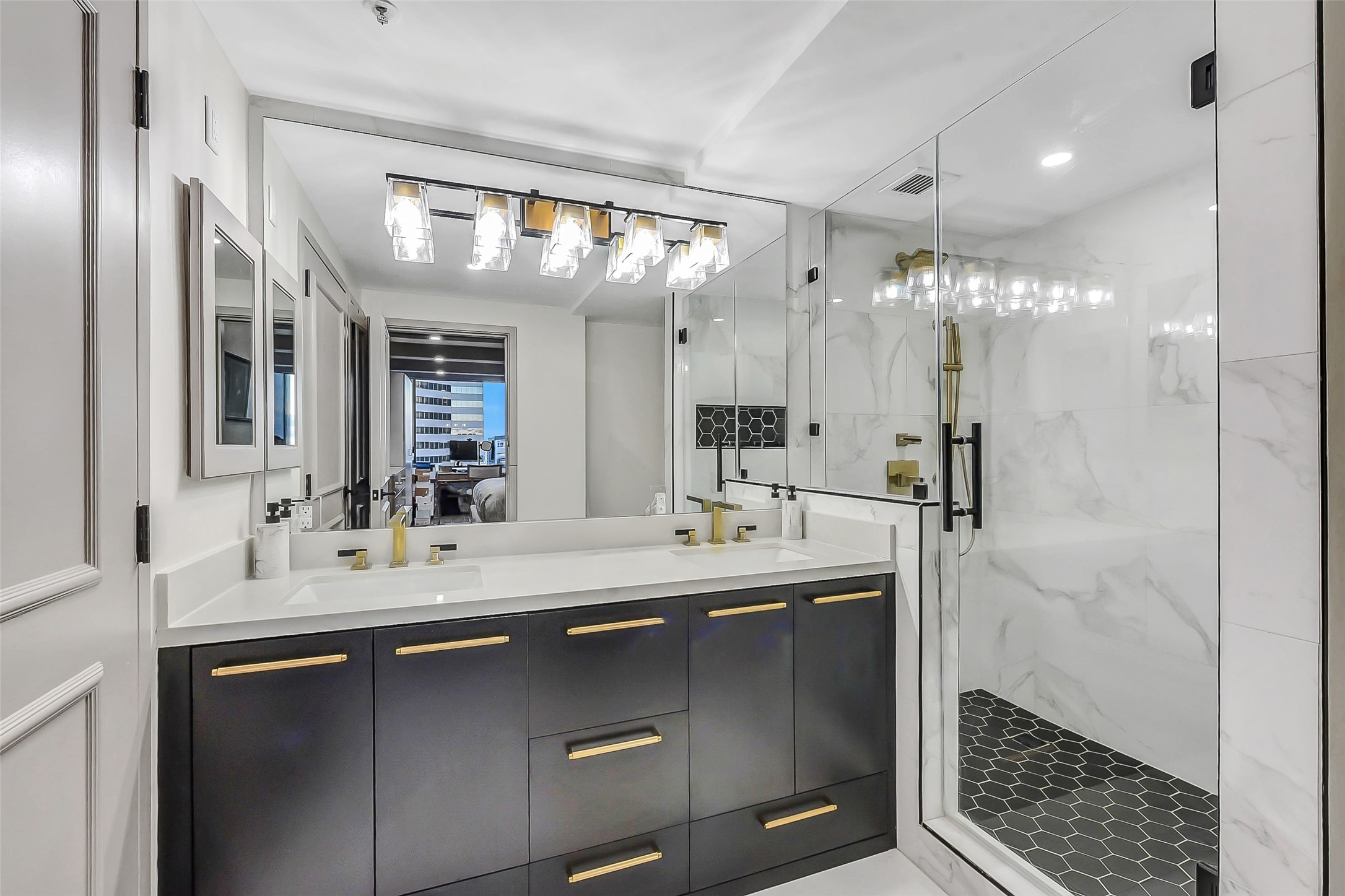 1111 Caroline Street, Unit 2903 Houston, TX 77010 - Photo 11 of 27 The primary bathroom is a masterclass in luxury, featuring dual vanities, contemporary fixtures, and a spacious layout designed for ultimate relaxation.