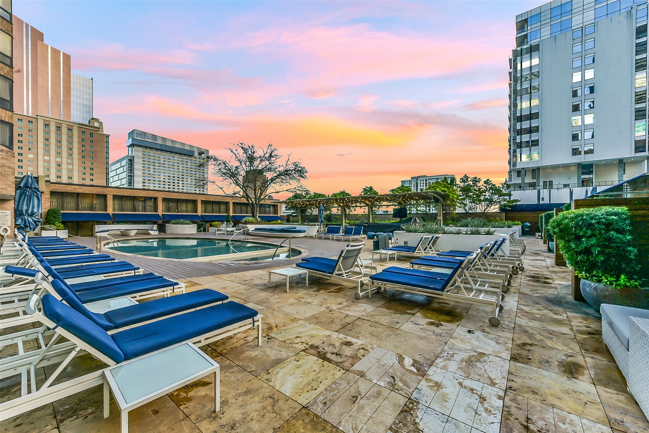1111 Caroline Street, Unit 2903 Houston, TX 77010 - Photo 16 of 27 The outdoor lounge area showcases plenty of comfortable seating, perfect for sunset relaxation.