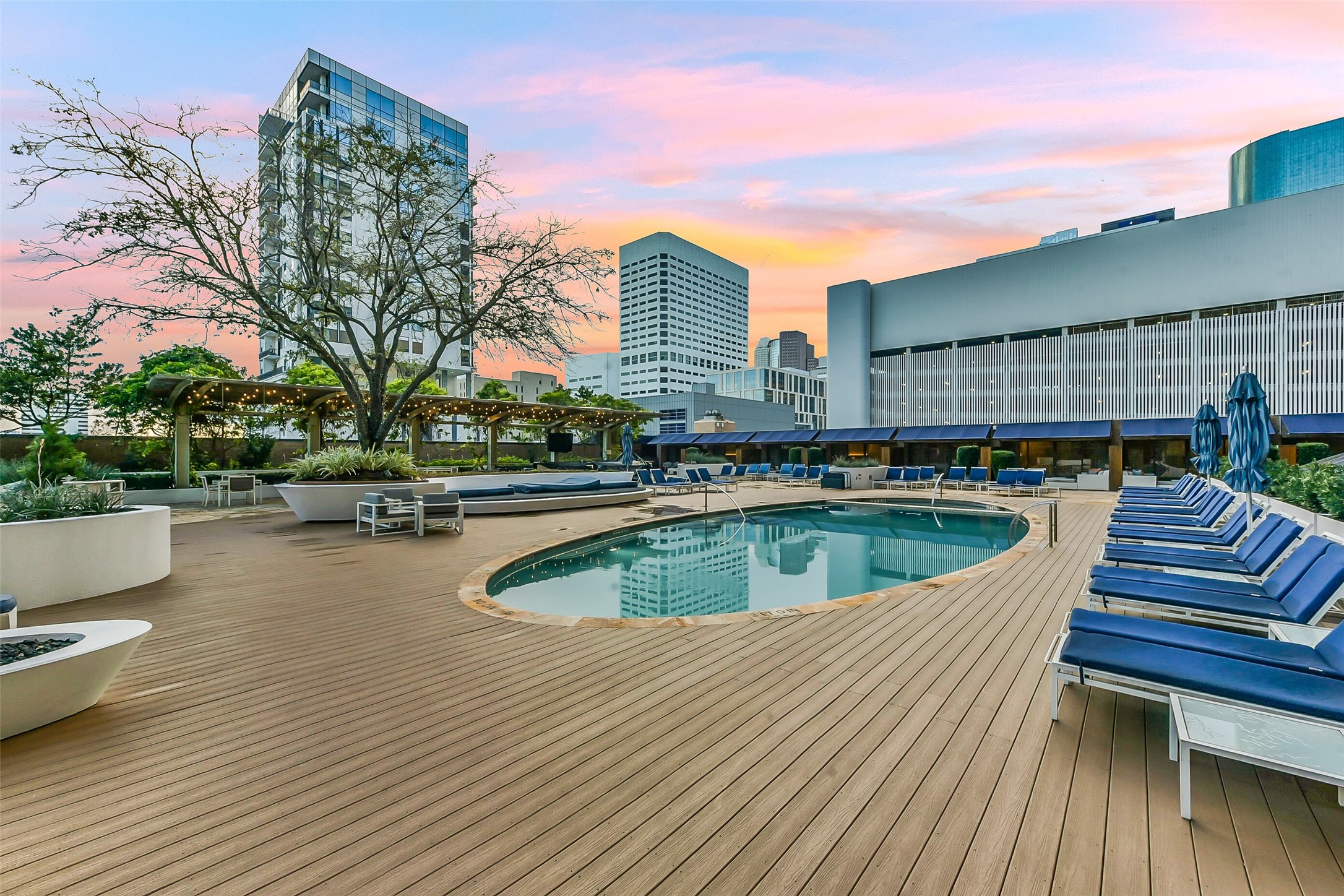 1111 Caroline Street, Unit 2903 Houston, TX 77010 - Photo 18 of 27 An expansive view of the 4th-floor pool deck, featuring the sparkling heated pool.