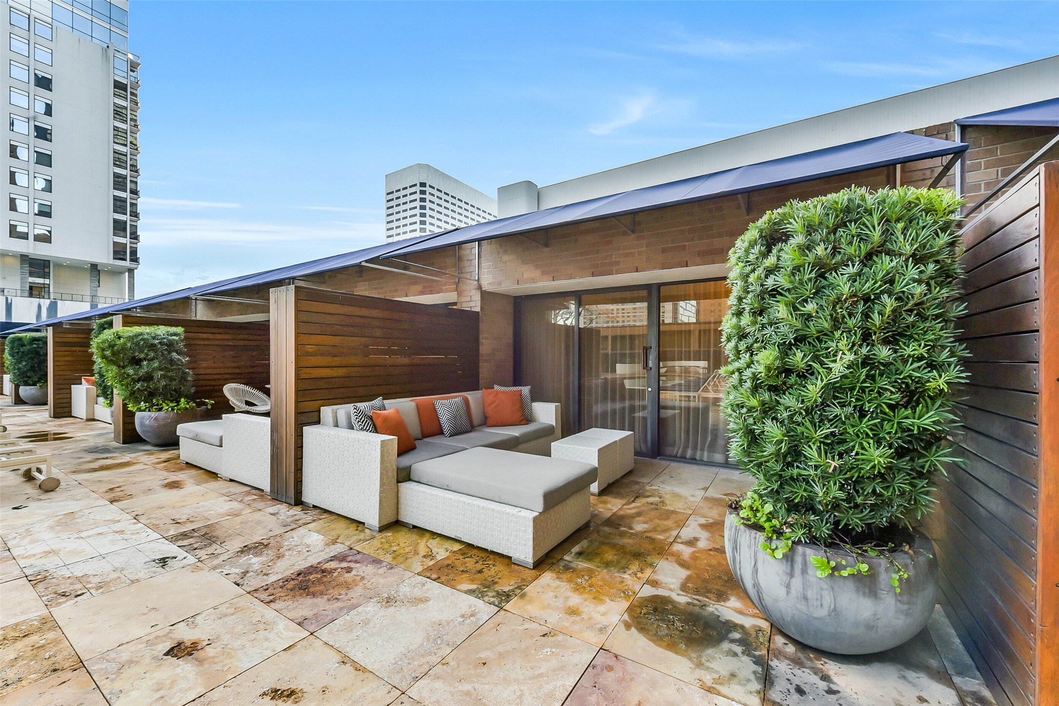 1111 Caroline Street, Unit 2903 Houston, TX 77010 - Photo 19 of 27 Luxury poolside cabanas offer a shaded retreat with a sophisticated tropical vibe.