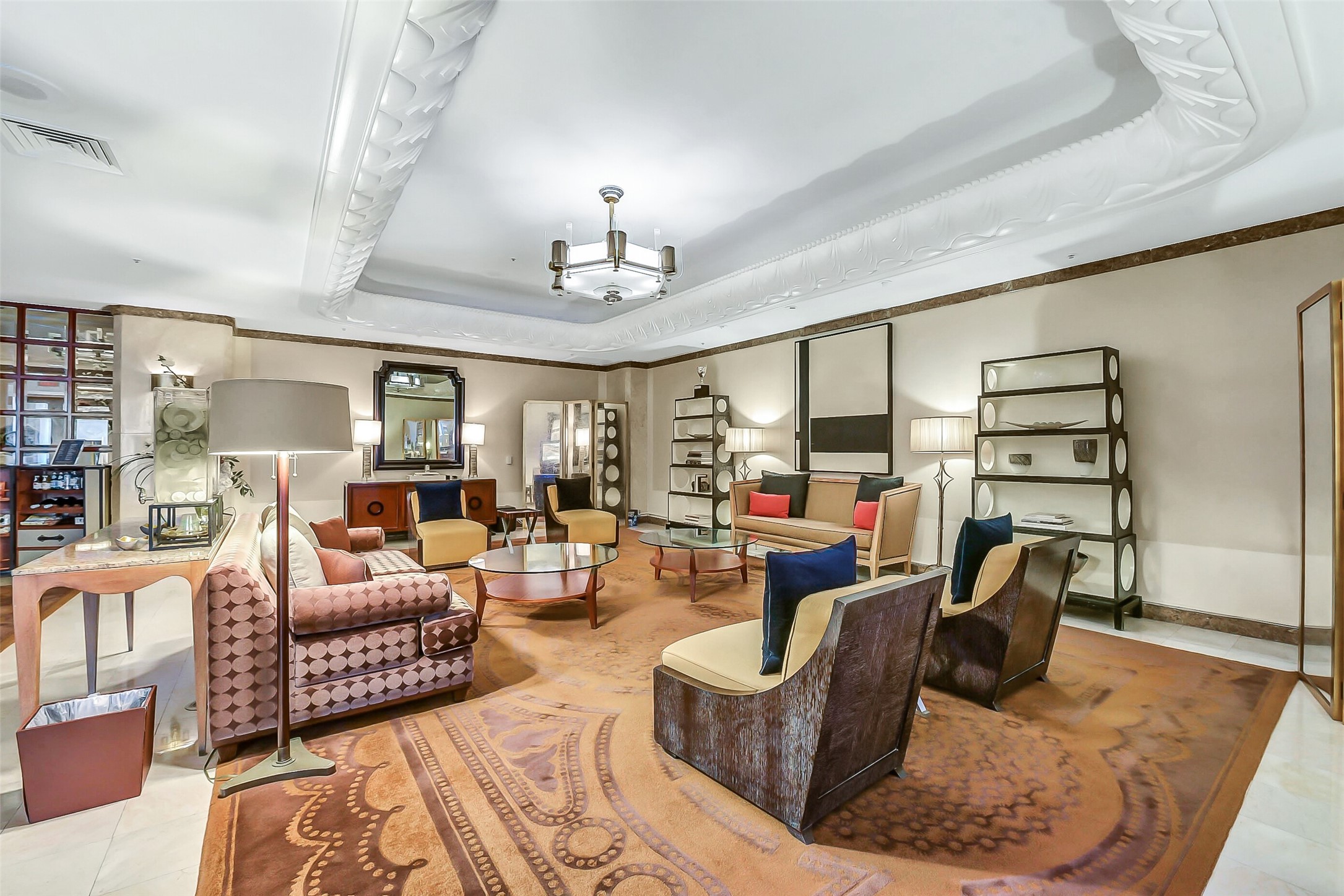 1111 Caroline Street, Unit 2903 Houston, TX 77010 - Photo 26 of 27 Featuring plush seating and a warm neutral palette this inviting space offers a serene environment for residents to greet guests or enjoy a quiet moment in the heart of the city's most prestigious address.