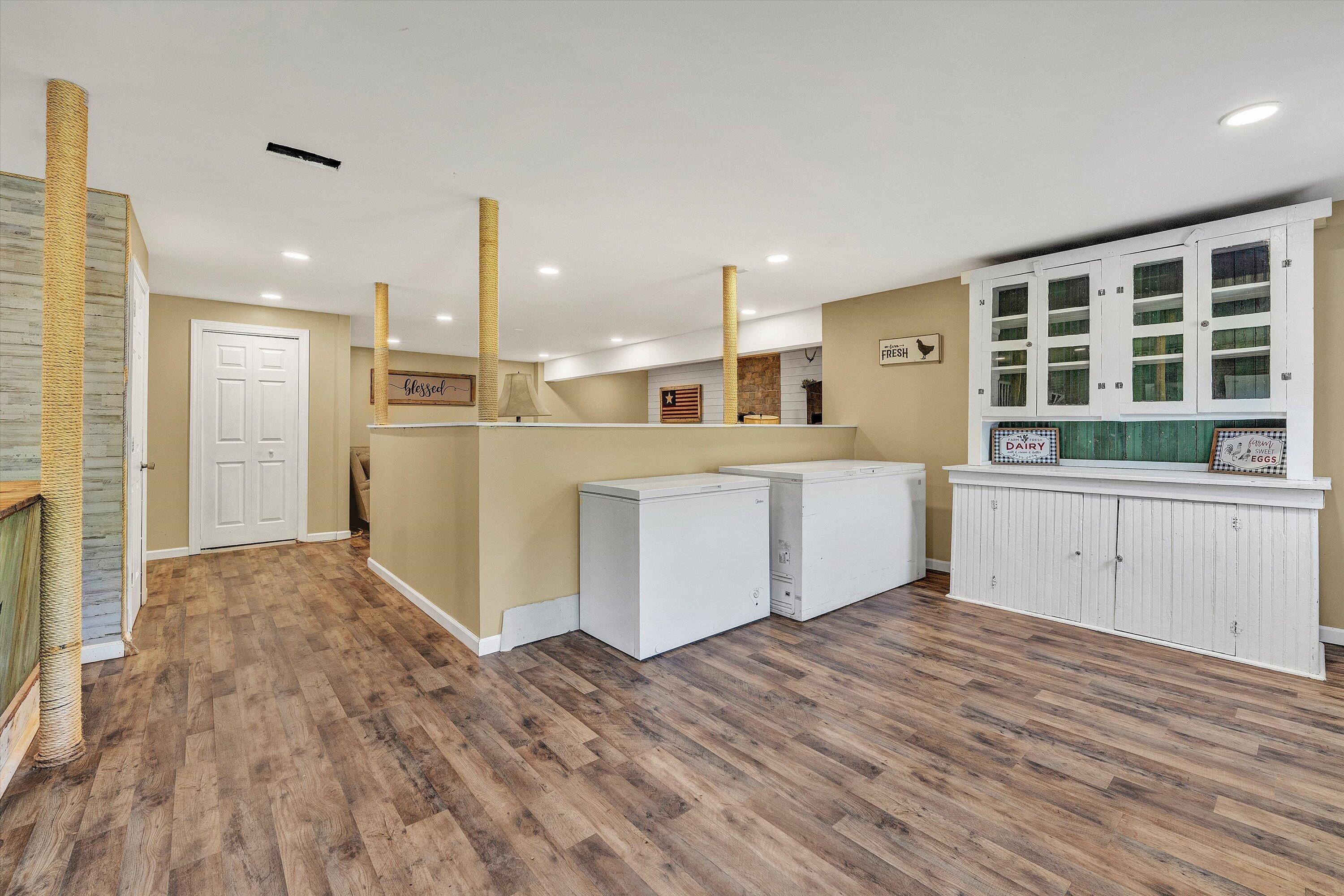 180 Thompson Ridge Circle Ferrum, VA 24088 - Photo 58 of 74 a view of a kitchen with a fridge and wooden floor