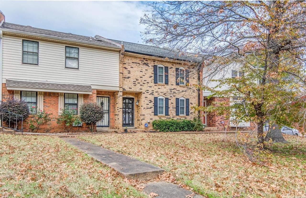 6410 Macon Road Memphis, TN 38134 - Photo 1 of 13 a front view of a house with a yard