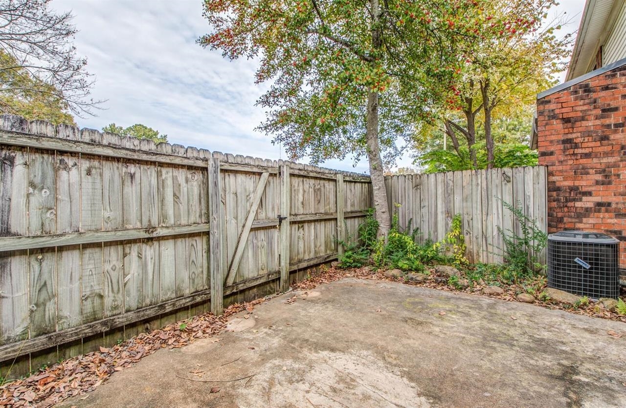 6410 Macon Road Memphis, TN 38134 - Photo 11 of 13 a view of a backyard with wooden fence