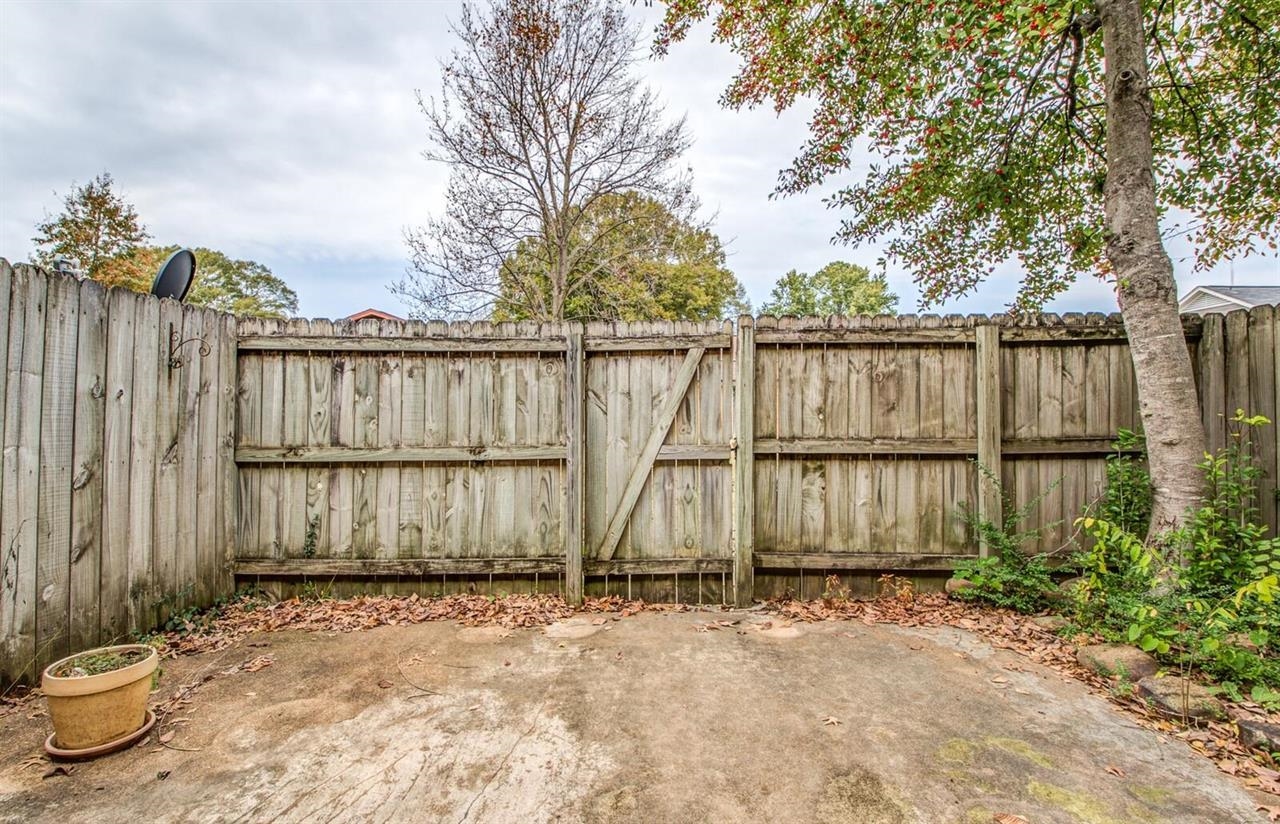 6410 Macon Road Memphis, TN 38134 - Photo 12 of 13 a view of outdoor space with wooden fence