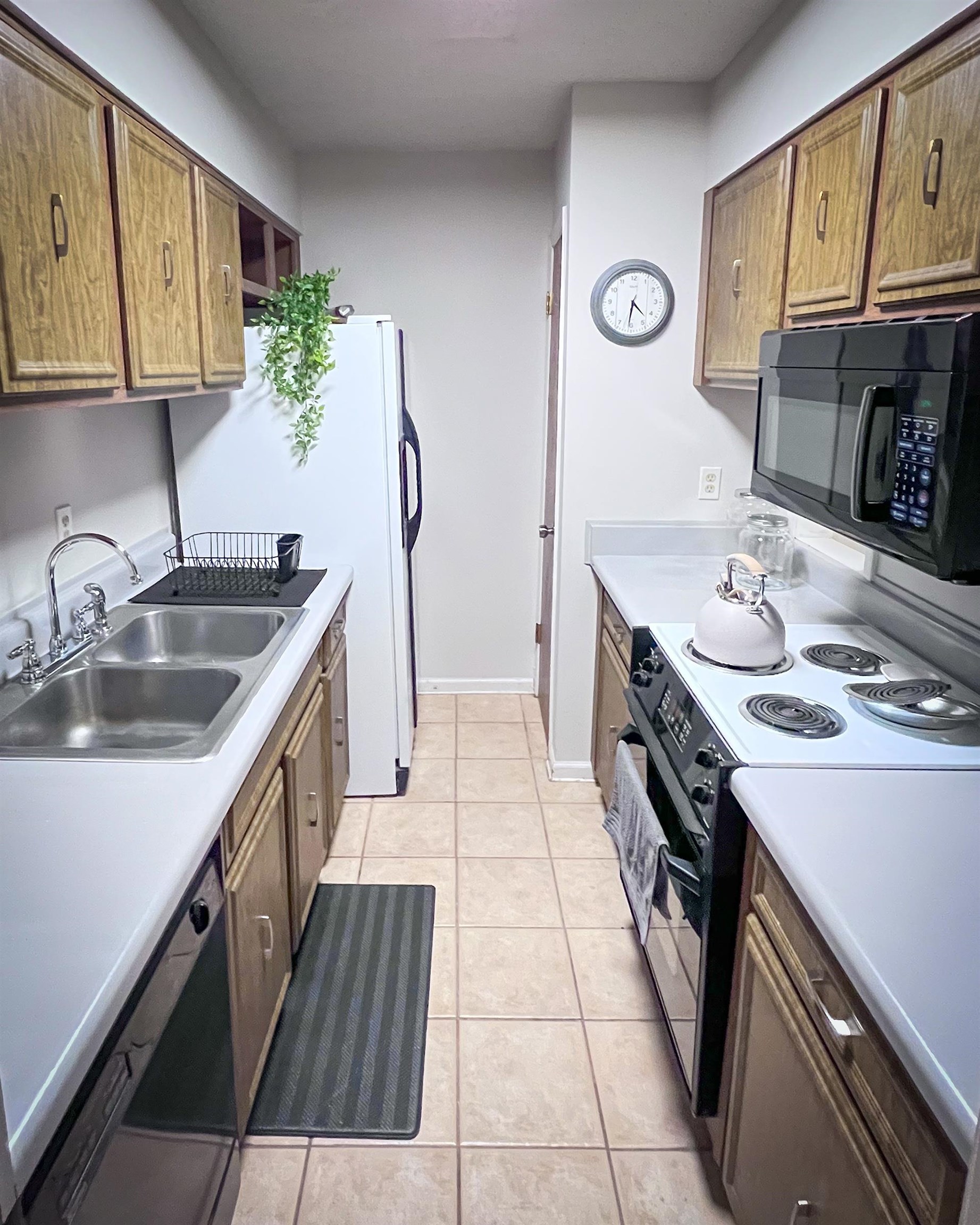 6410 Macon Road Memphis, TN 38134 - Photo 4 of 13 a kitchen with granite countertop a sink and a stove top oven