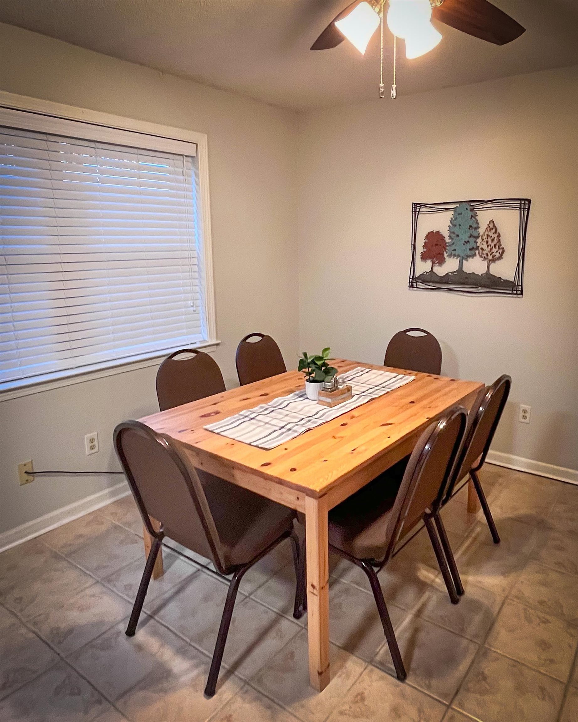 6410 Macon Road Memphis, TN 38134 - Photo 10 of 13 a view of a dining table and chairs in a room