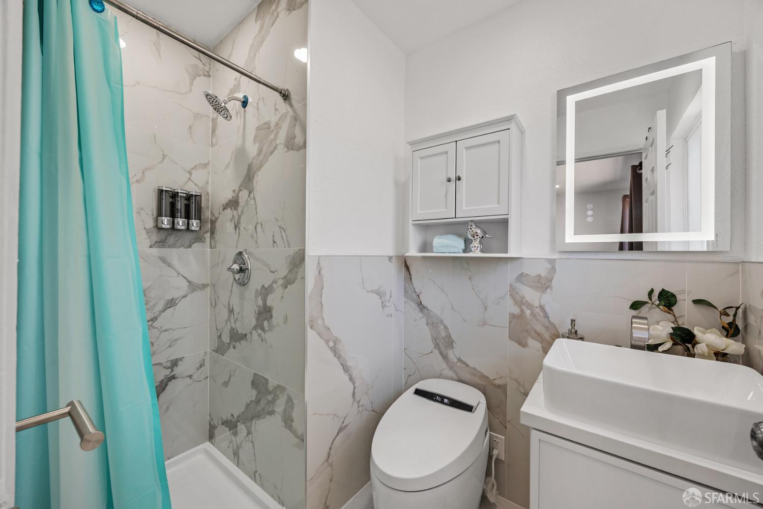 3138 Flannery Road San Pablo, CA 94806 - Photo 16 of 38 a white toilet sitting next to a bathroom sink