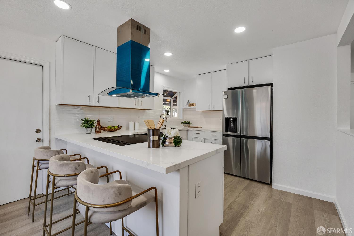3138 Flannery Road San Pablo, CA 94806 - Photo 9 of 38 a kitchen with refrigerator and chairs