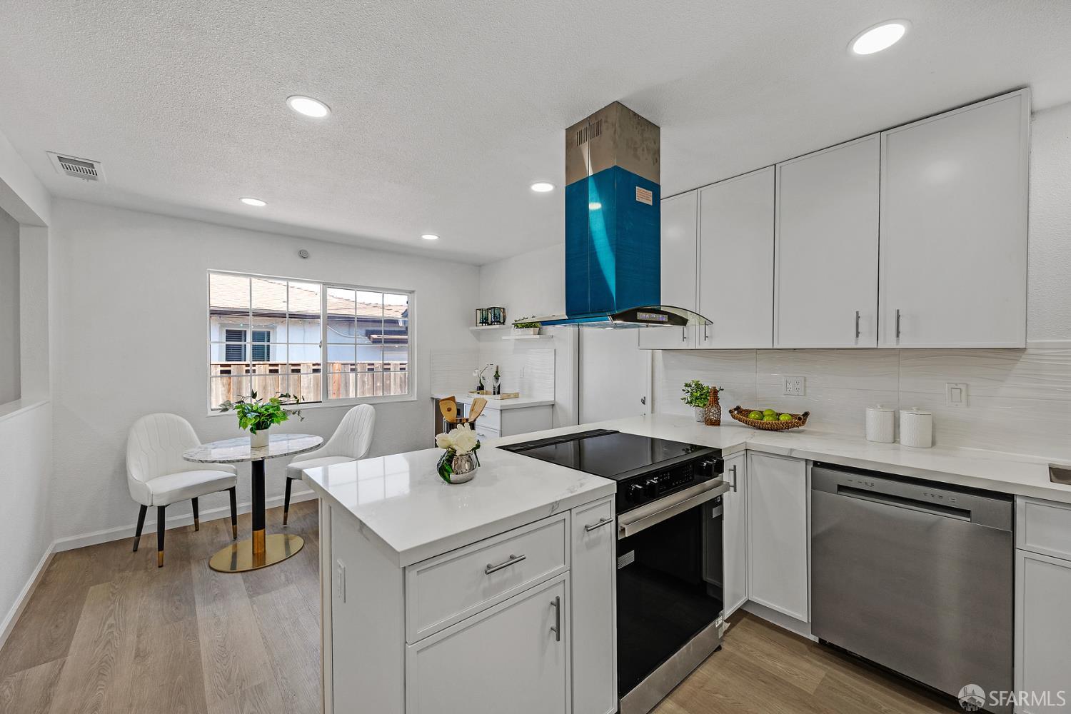 3138 Flannery Road San Pablo, CA 94806 - Photo 10 of 38 a kitchen with a sink cabinets and wooden floor