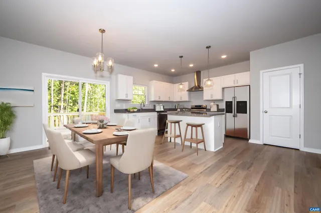 a view of kitchen with wooden floor and window