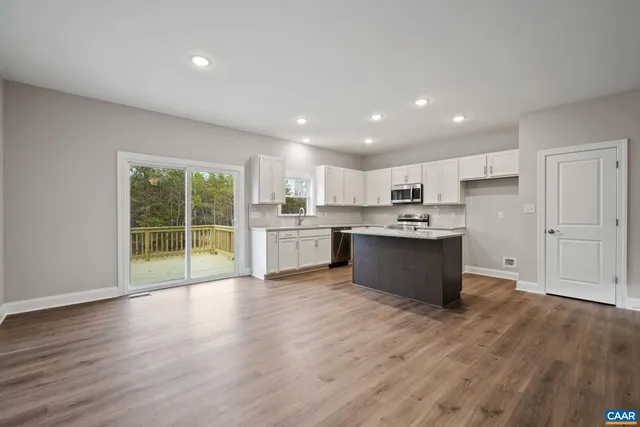 a kitchen with a table and chairs in it
