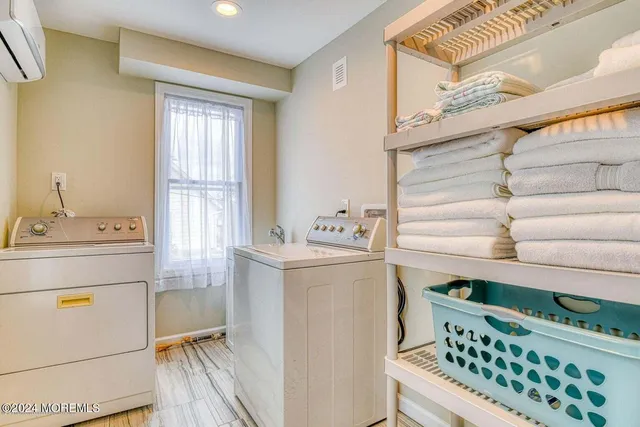a utility room with washer and dryer