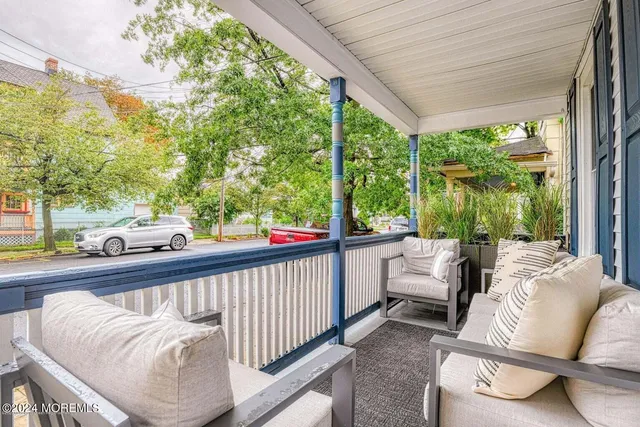 a view of balcony with furniture
