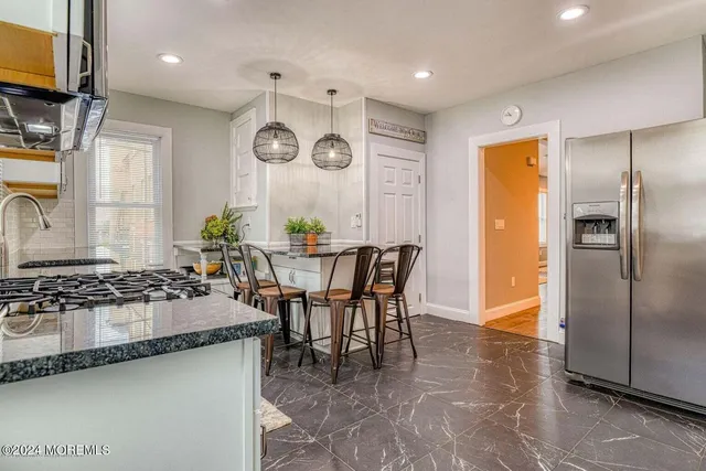 a kitchen with a table and chairs in it