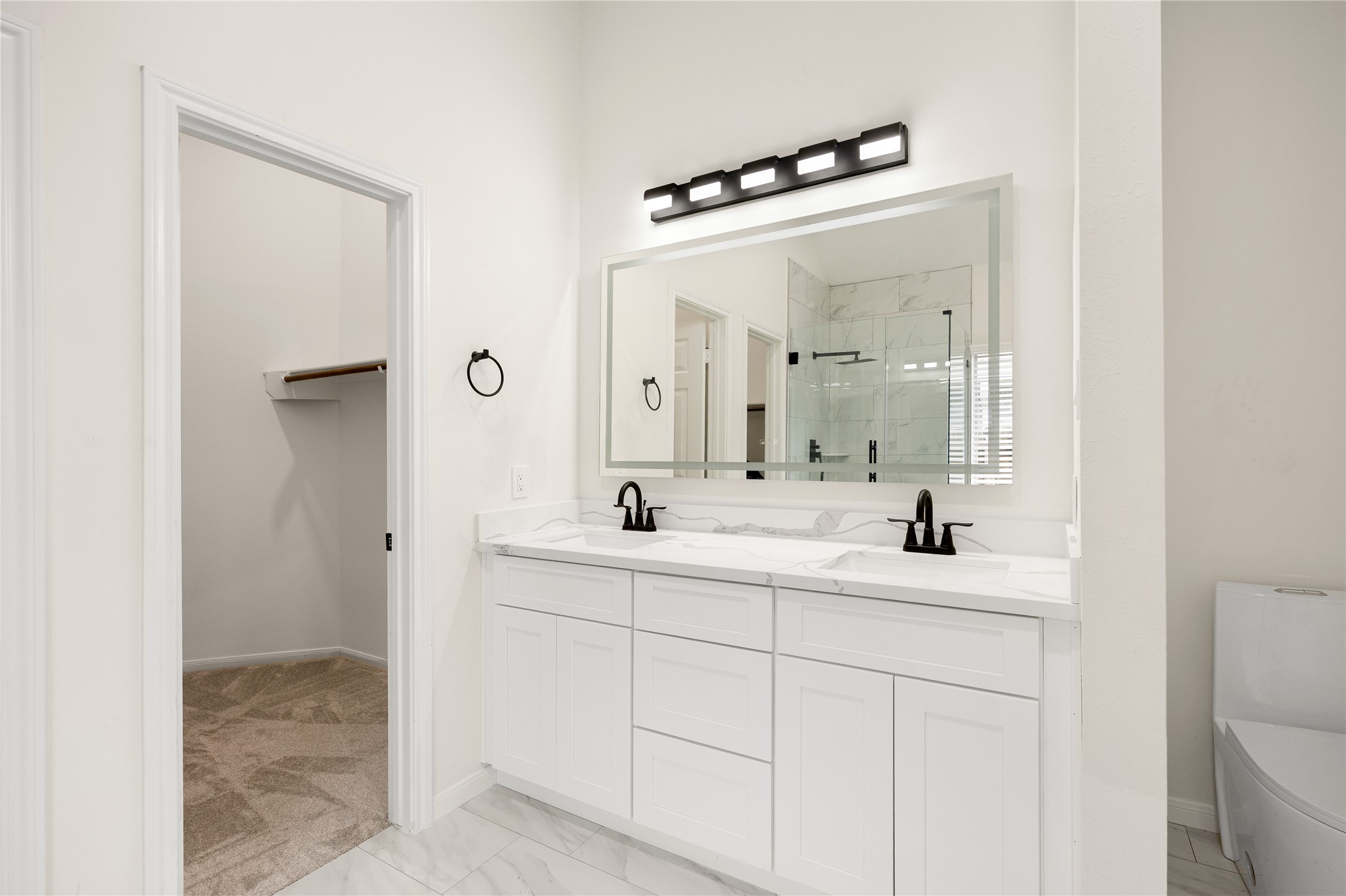 13735 Sablegarden Lane Houston, TX 77014 - Photo 12 of 20 a bathroom with a sink and a mirror