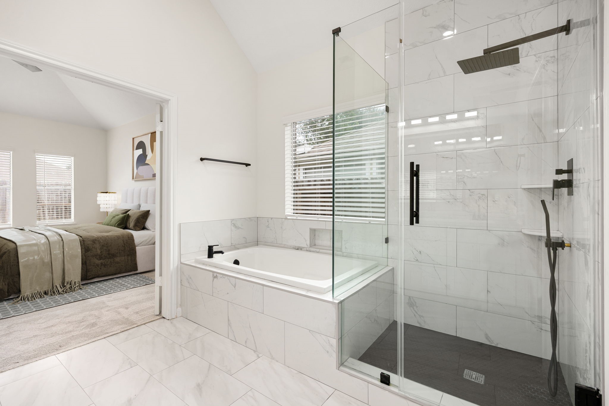 13735 Sablegarden Lane Houston, TX 77014 - Photo 13 of 20 a bathroom with a tub a sink and a shower