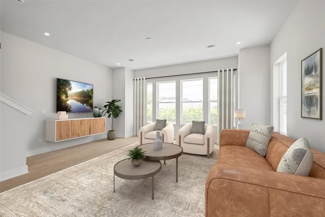 a living room with furniture and a large window