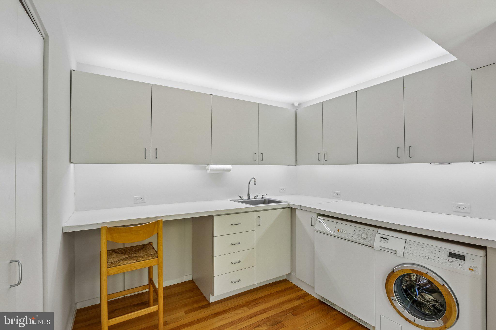 1673 Paper Mill Road Jenkintown, PA 19046 - Photo 52 of 73 a utility room with cabinets washer and dryer