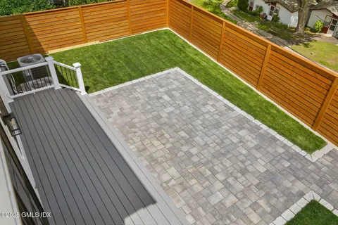 a view of a backyard with sitting area