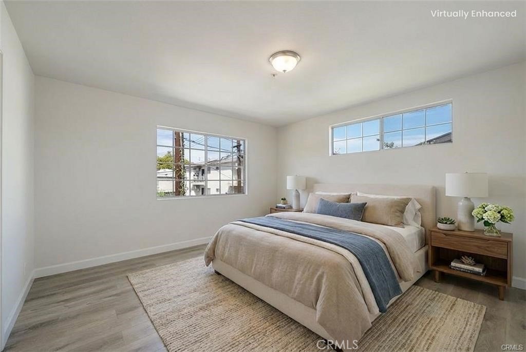 134 North Atlantic Boulevard, Unit B Alhambra, CA 91801 - Photo 11 of 18 a bedroom with a bed and a window