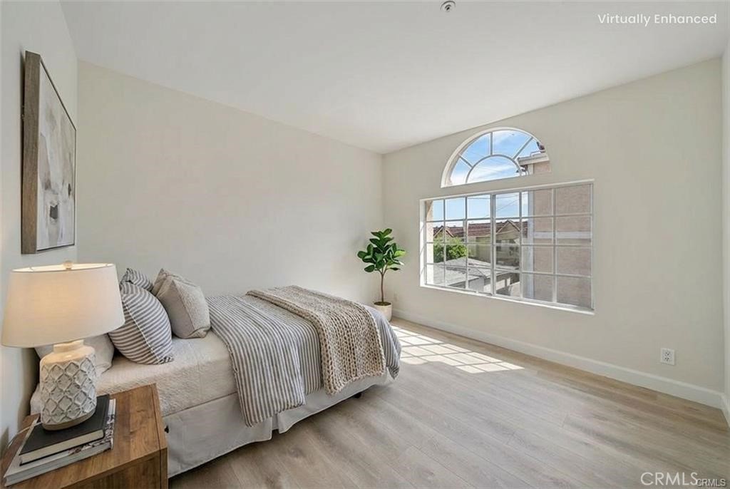 134 North Atlantic Boulevard, Unit B Alhambra, CA 91801 - Photo 8 of 18 a spacious bedroom with a bed and a window