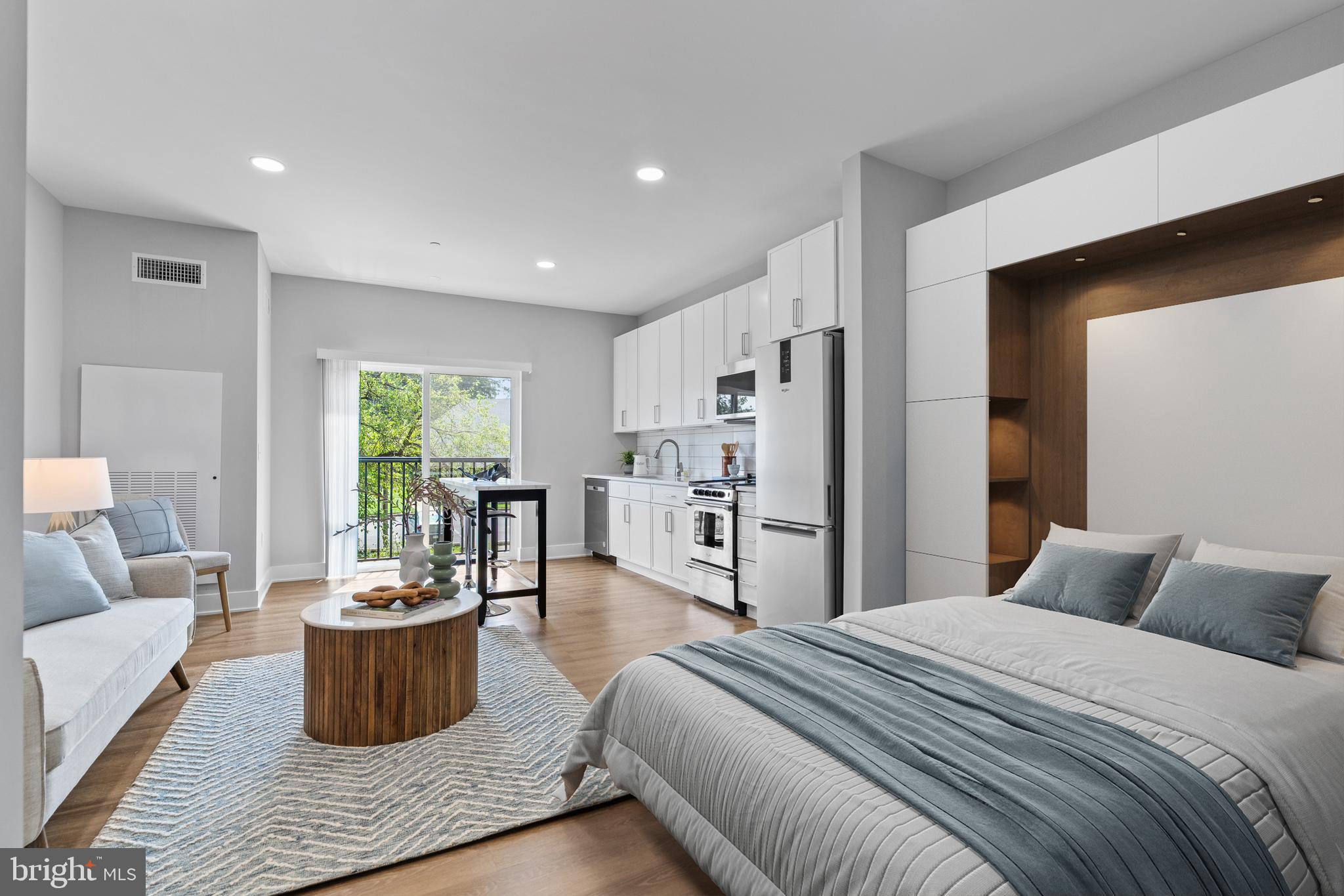a bedroom with a large bed and a potted plant
