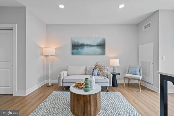 a living room with furniture and a rug