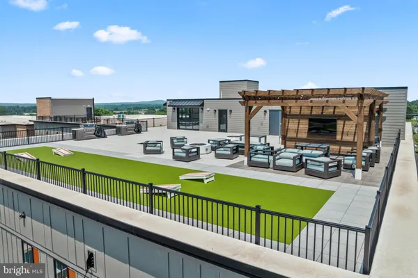 a view of a house with outdoor seating