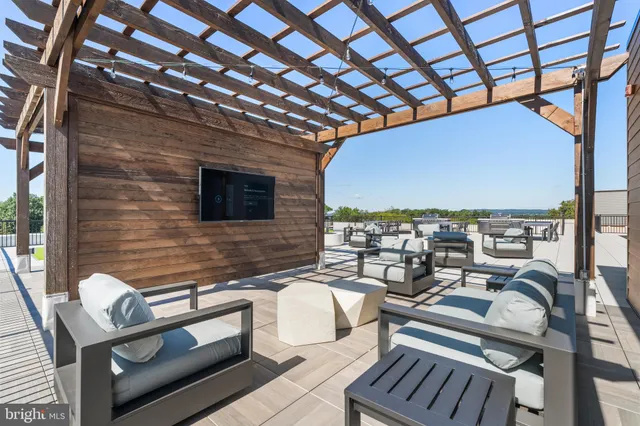 a roof deck with patio