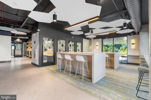 a view of a porch with furniture and a backyard