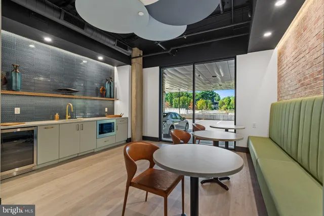 a open kitchen with a table and chairs