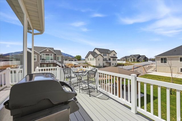 283 North 500 West Mapleton, UT 84664 - Photo 86 of 102 Wooden deck with grilling area, a residential view, and a lawn.