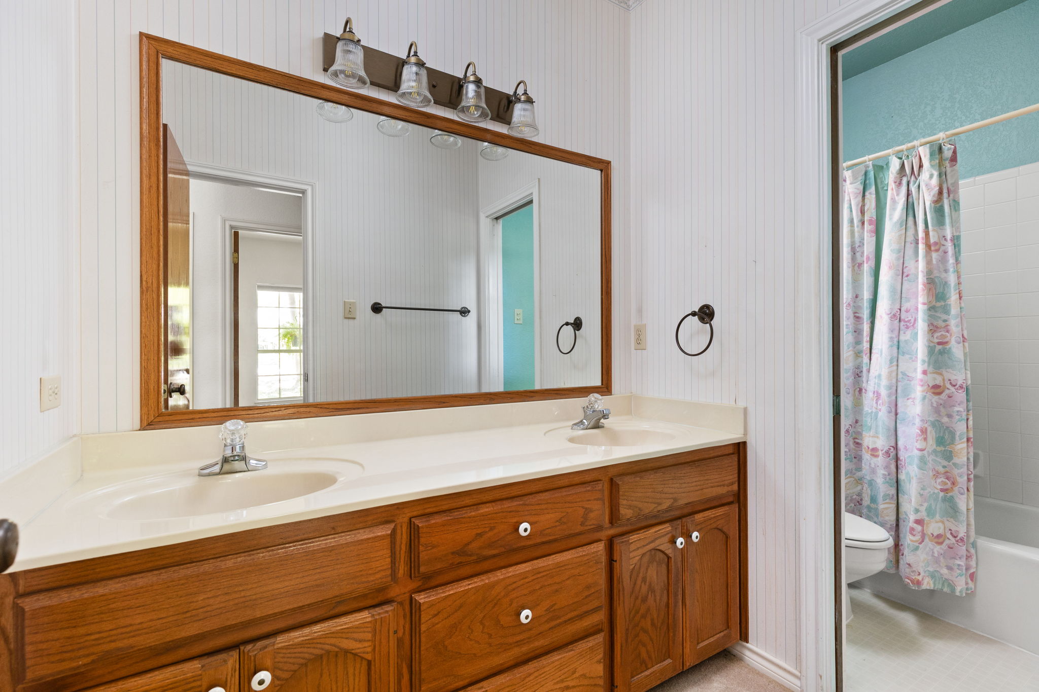134 Canyon Road Georgetown, TX 78628 - Photo 21 of 40 Double vanity sinks and classic wood cabinets define this functional bathroom layout.