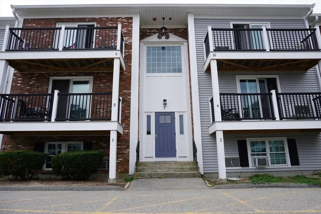 a view of front of a house with large windows
