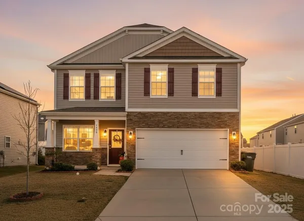 a view of a house with a parking area