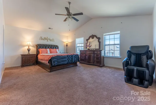 a bedroom with a bed and a cabinets