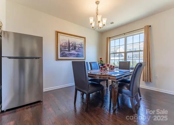 a kitchen with granite countertop stainless steel appliances and wooden cabinets